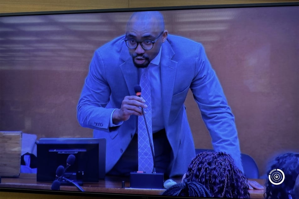 Miles Henderson is pictured on screen delivering testimony before the United Nations Permanent Forum on People of African Descent.