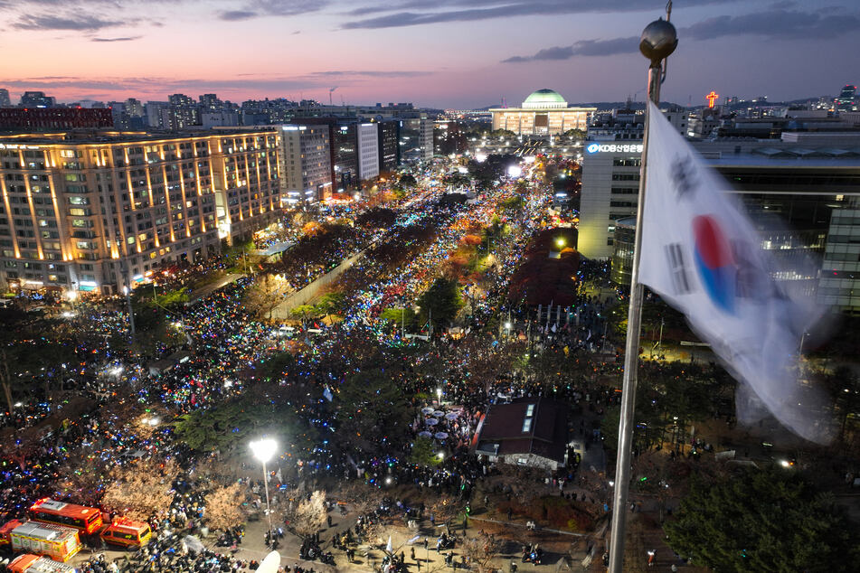 Tens of thousands of South Koreans took to the streets Saturday to demand the impeachment of Yoon.