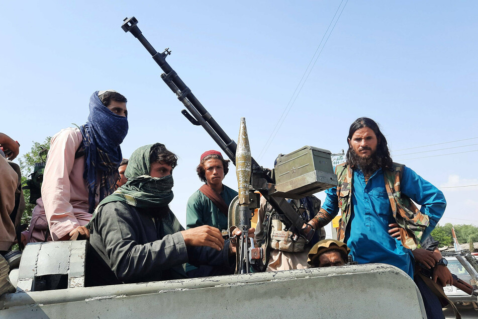Taliban militants are seen in Mehtarlam, capital of the Laghman province.