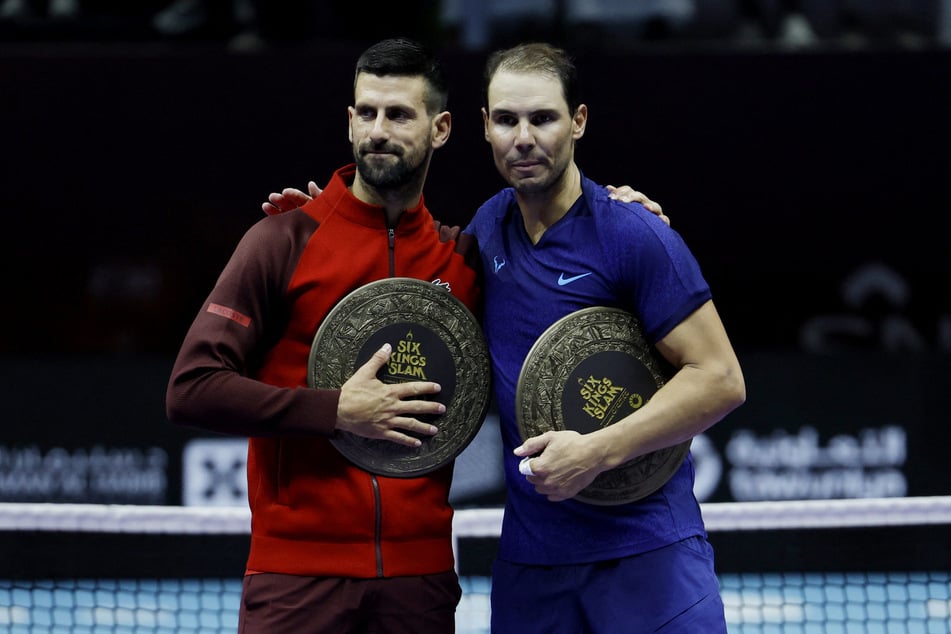 Serbia's Novak Djokovic and Spain's Rafael Nadal pose after their third-place match at the Six Kings Slam in Riyadh, Saudi Arabia.