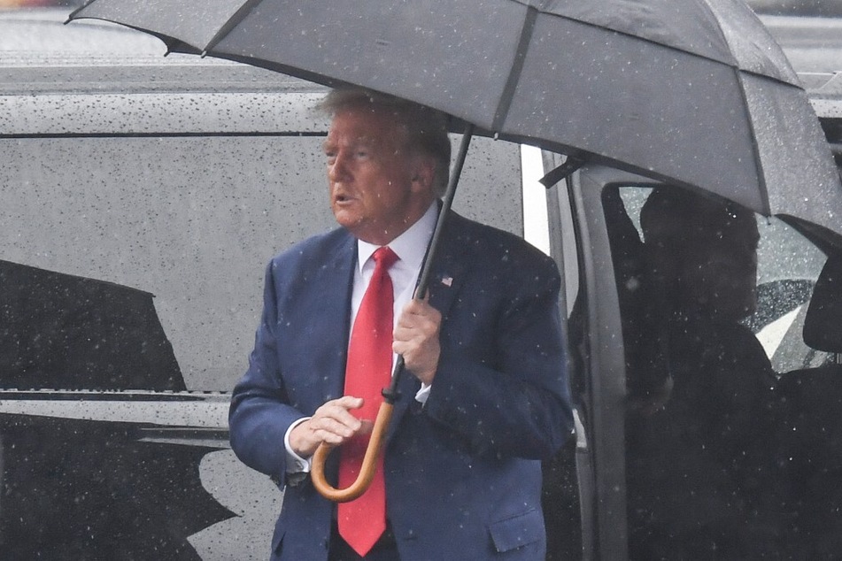 Former President Donald Trump arrives at Ronald Reagan Washington National Airport in Arlington, Virginia, on August 3, 2023, after his arraignment in court in the 2020 election probe.