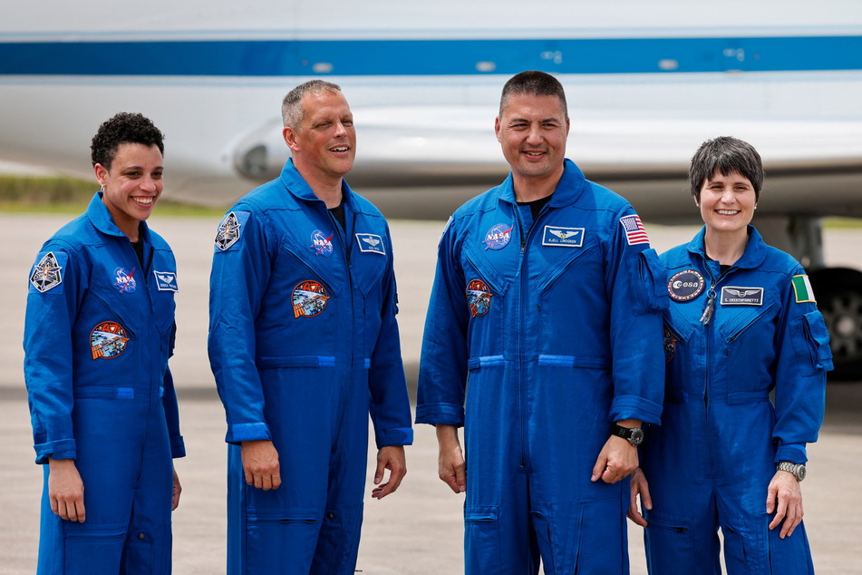 From l. to r.: NASA astronauts Jessica Watkins, Robert Hines, and Kjell Lindgren, along with European Space Agency astronaut Samantha Cristoforetti, pose for a picture ahead of their scheduled launch on the Crew Dragon spacecraft.