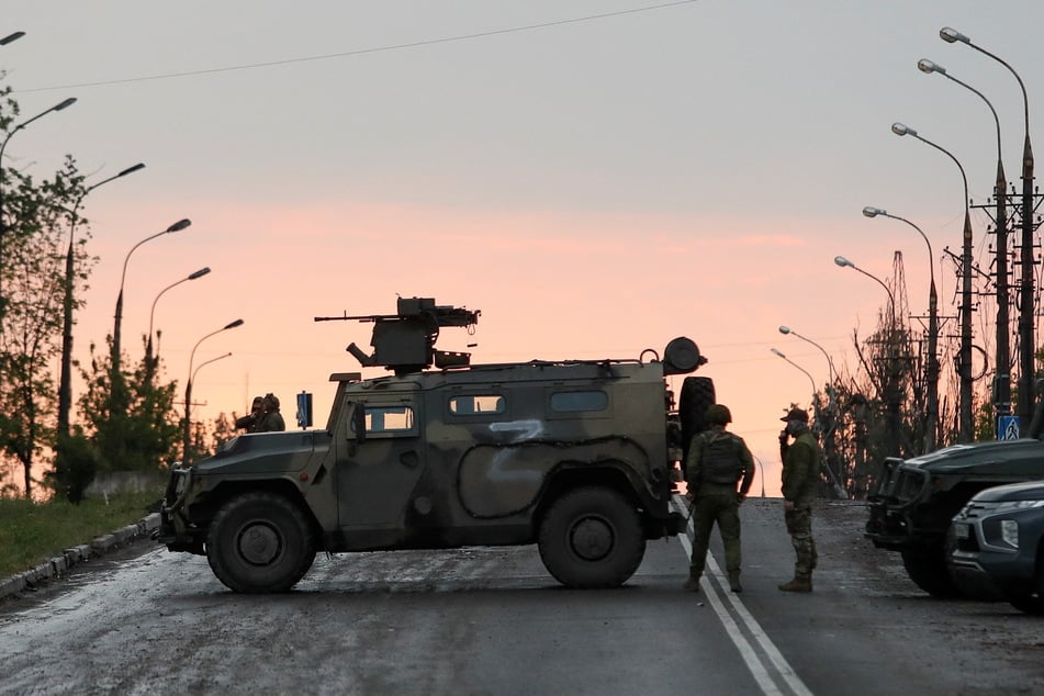 Pro-Russian troops block the road in eastern Ukraine.