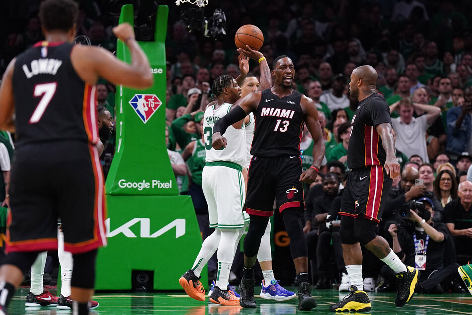 Bam Adebayo (2nd from r.) celebrates after scoring against the Celtics.