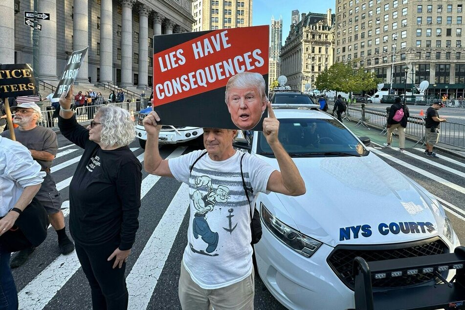 Protestors before the arrival of former President Donald Trump to New York State Supreme court for the start of his civil fraud trial on Monday.