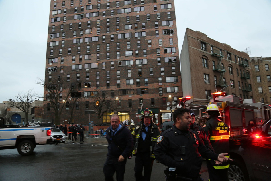 Rescue workers at the scene of the deadly fire in the Bronx.