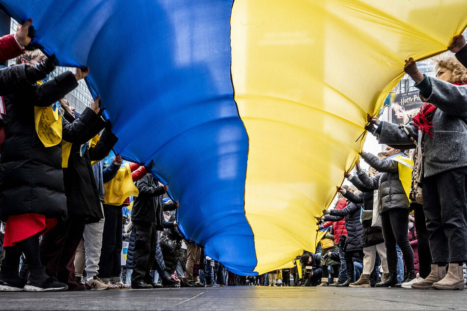 New Yorkers gather in solidarity with Ukraine at the Stop Putin rally in Times Square.