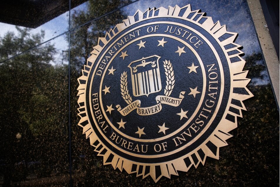 On Friday, the FBI fired more than a dozen agents over a photo that showed them kneeling during racial injustice protests in 2020.
