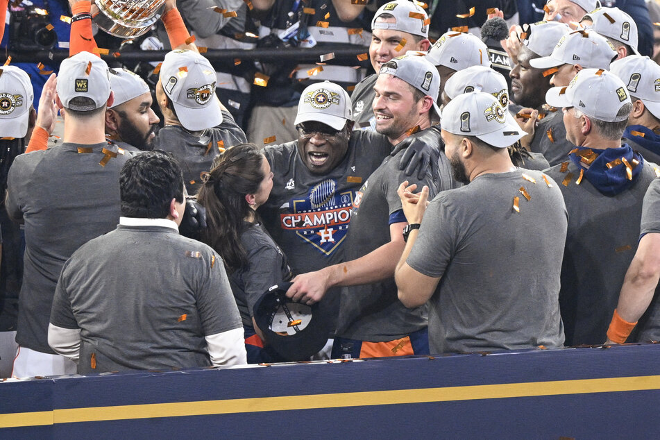 Houston Astros manager Dusty Baker Jr. (center) and the Astros celebrate winning the World Series.