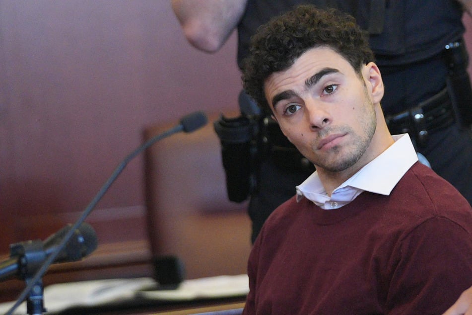 Luigi Magione appears in court to answer state charges of "terrorist" murder