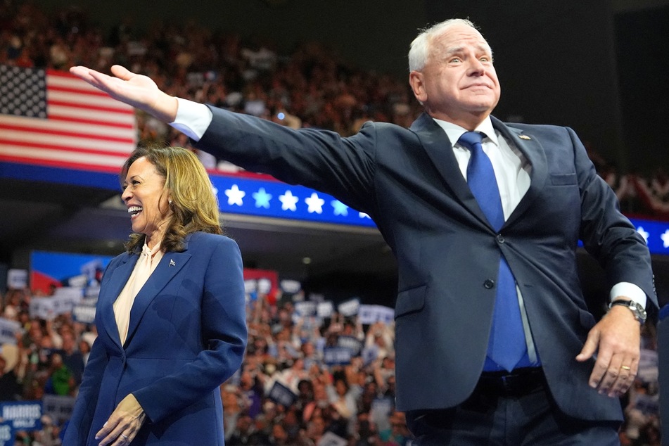 Democratic presidential candidate Kamala Harris and her running mate, Tim Walz, on stage during a campaign event in Philadelphia, Pennsylvania on August 6, 2024.