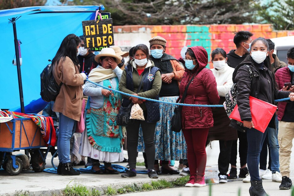 Students and relatives wait for information after the accident in which several students died at UPEA.