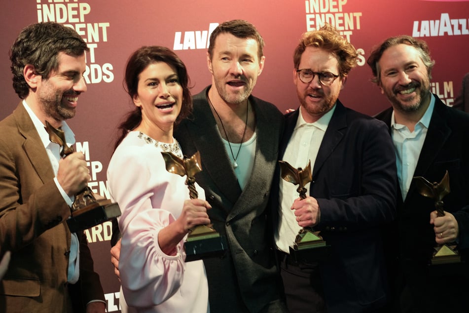 Brazilian cinematographer Adolpho Veloso, producer Marissa McMahon, Australian actor Joel Edgerton, director Clint Bentley, and producer Teddy Schwarzman pose in the press room with the Best Feature award for Train Dreams during the 41st Film Independent Spirit Awards on February 15, 2026.