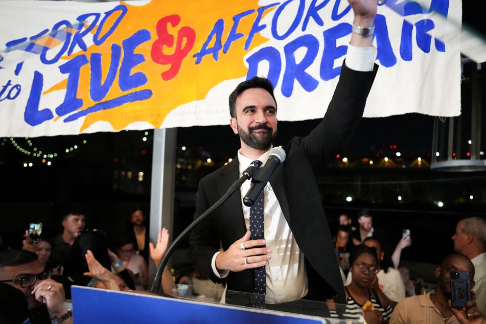 Zohran Mamdani waves to the crowd as he speaks during a watch party for his primary election to become the Democratic nominee for New York City mayor on June 25, 2025.