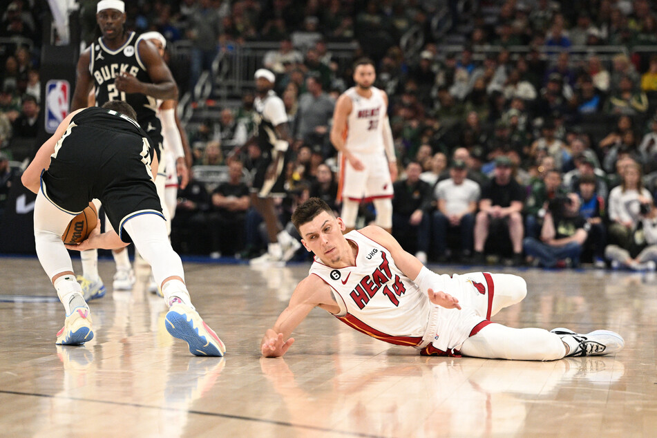 Miami Heat guard Tyler Herro injures his hand while diving for a loose ball against the Milwaukee Bucks during Game 1 of the 2023 NBA Playoffs at Fiserv Forum.