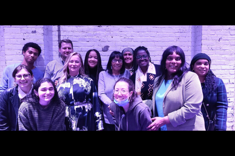 Members of the African Heritage Reparation Assembly and Amherst residents pose together during a screening of The Big Payback with former Evanston, Illinois, Alderwoman Robin Rue Simmons.