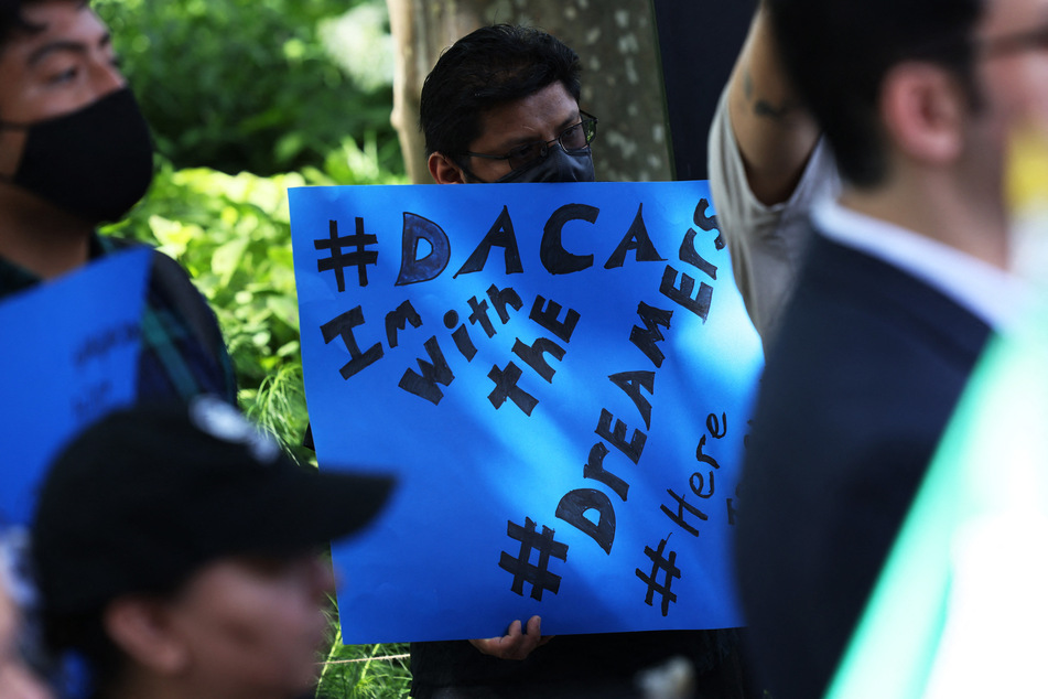 People gather for a rally on the 10th anniversary of the DACA program in New York City's Battery Park on June 15, 2022.