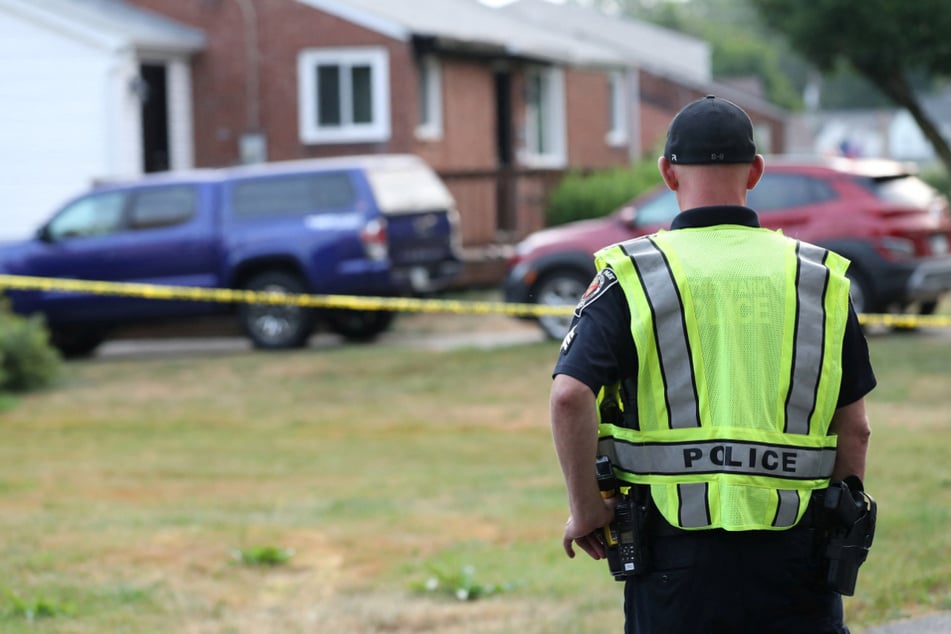 A police officer looks at the home of 20-year-old Thomas Matthew Crooks in Bethel Park, Pennsylvania, on July 15.