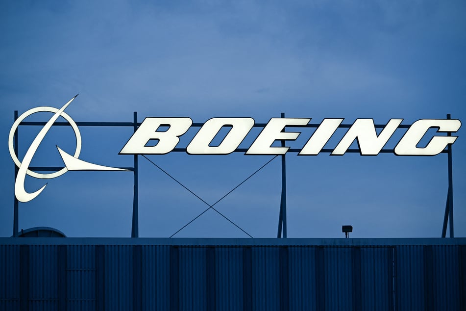 Boeing reported a bigger-than-expected loss fueled by $280 million in additional costs in outfitting two presidential planes.