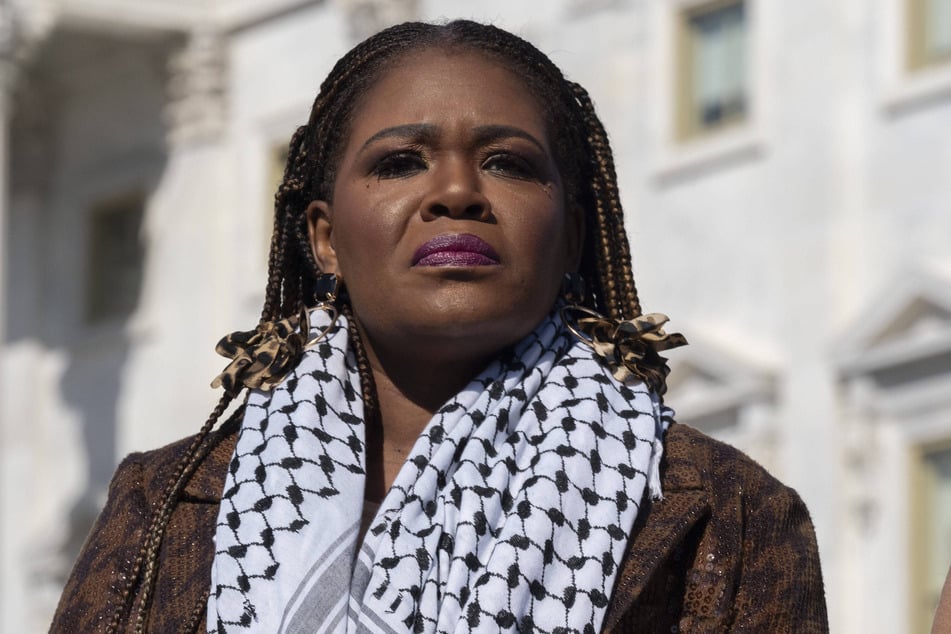 Representative Cori Bush wears a Palestinian keffiyeh during a Capitol Hill press conference calling for a permanent ceasefire in Gaza.