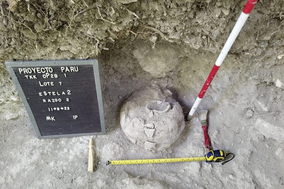 This picture released by the Guatemalan Ministry of Culture and Sports shows a pot discovered at the Uaxactun archeological site in the Maya Biosphere, Peten department.