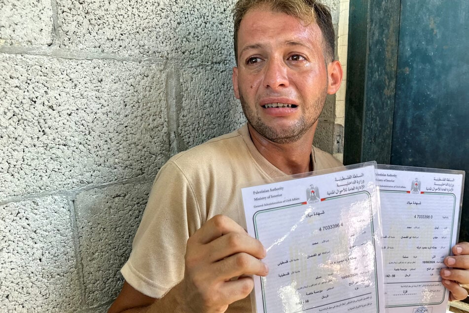 Gaza father returns home with birth certificates to find newborn twins killed in Israeli attack