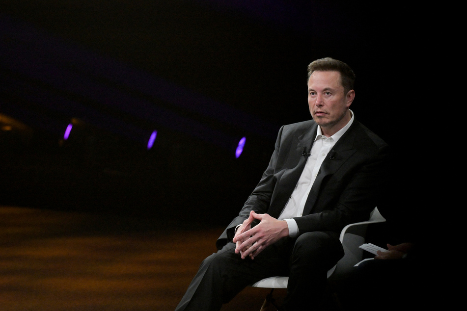 Elon Musk (pictured) said his artificial intelligence company would release a new AI model on Saturday to a "select group" of users as he looks to rival industry leaders OpenAI and Google.