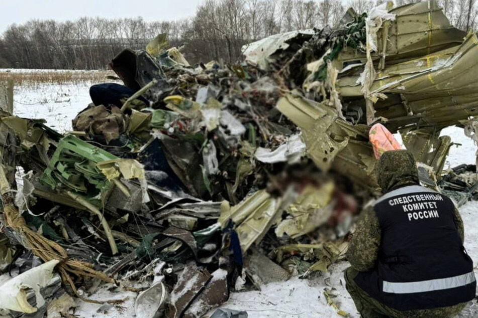 Ukraine has opened an investigation into the downing of a Russian plane carrying scores of Ukrainian prisoners of war.