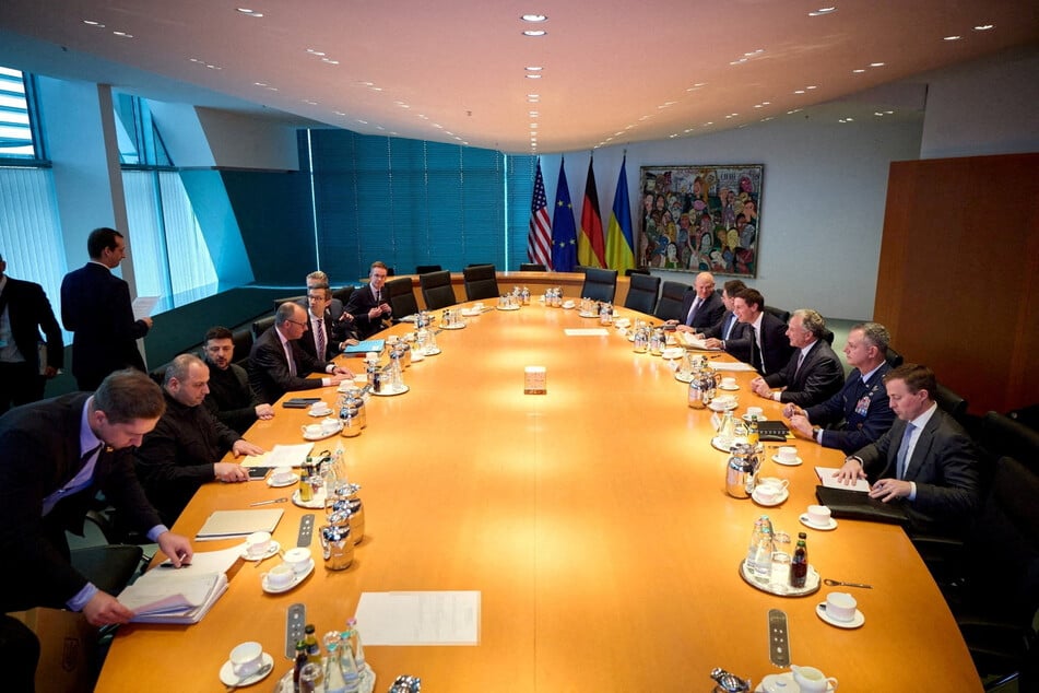 Ukraine's President Volodymyr Zelensky, senior Ukrainian negotiator Rustem Umerov, and German Chancellor Friedrich Merz meet with US envoys in Berlin, Germany, on December 14, 2025.