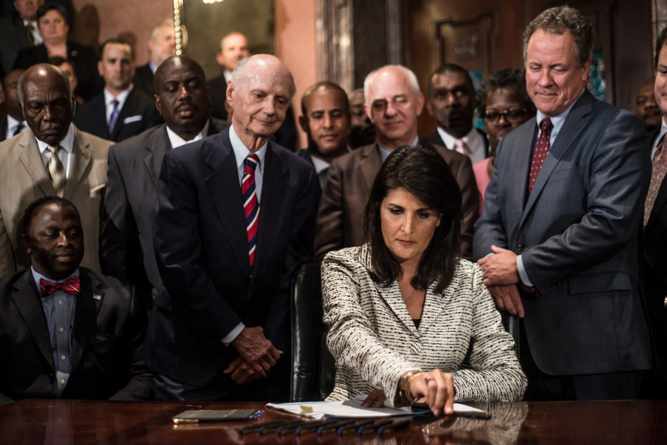 Haley in 2015 signed a bill approving the removal of the Confederate flag from outside the South Carolina Capitol building.