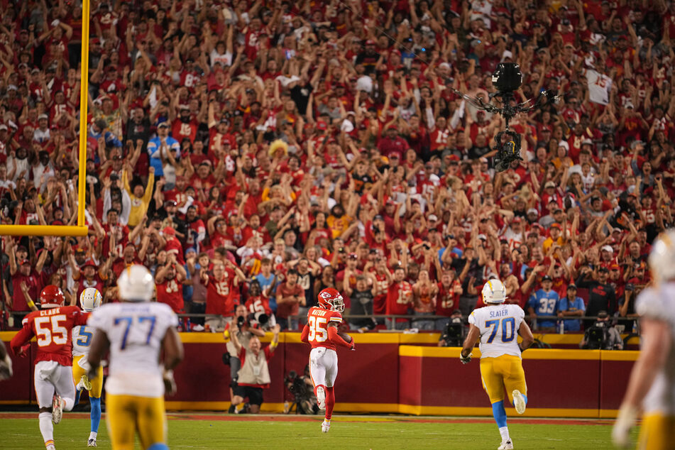 Kansas City Chiefs cornerback Jaylen Watson runs for a touchdown after an interception against the Los Angeles Chargers.