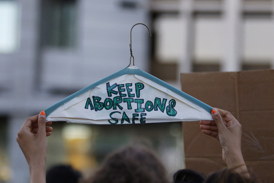 An abortion rights protester holds a sign outside the Federal Court House in Las Vegas, Nevada, on June 24, 2022.