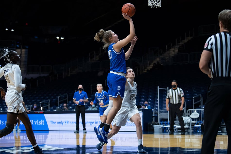 Bluejays forward Morgan Maly (c) came off the bench to lead Creighton with 21 points against Iowa State.