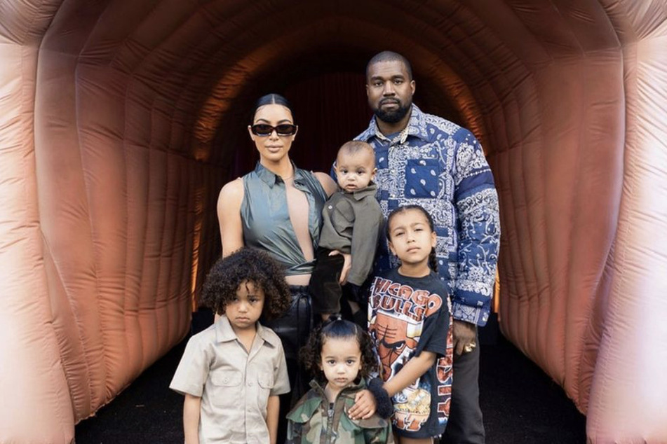 Happier times: Kim Kardashian and Kanye "Ye" West pose with their four children (clockwise): Saint, Psalm, North, and Chicago.