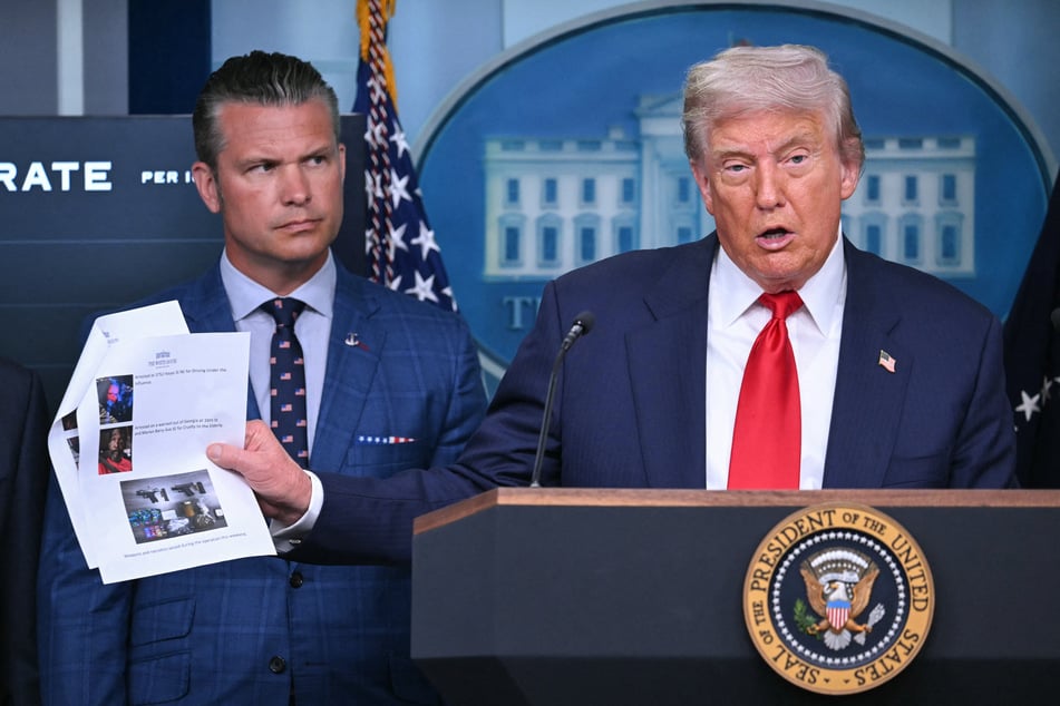 President Donald Trump (r.), alongside Secretary of Defense Pete Hegseth (l.), speaks during a news conference to discuss crime in Washington, DC on Monday.