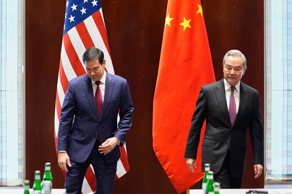 US Secretary of State Marco Rubio (l.) and China's Foreign Minister Wang Yi (r.) arrive for a bilateral meeting on February 13, 2026, on the sidelines of the Munich Security Conference.
