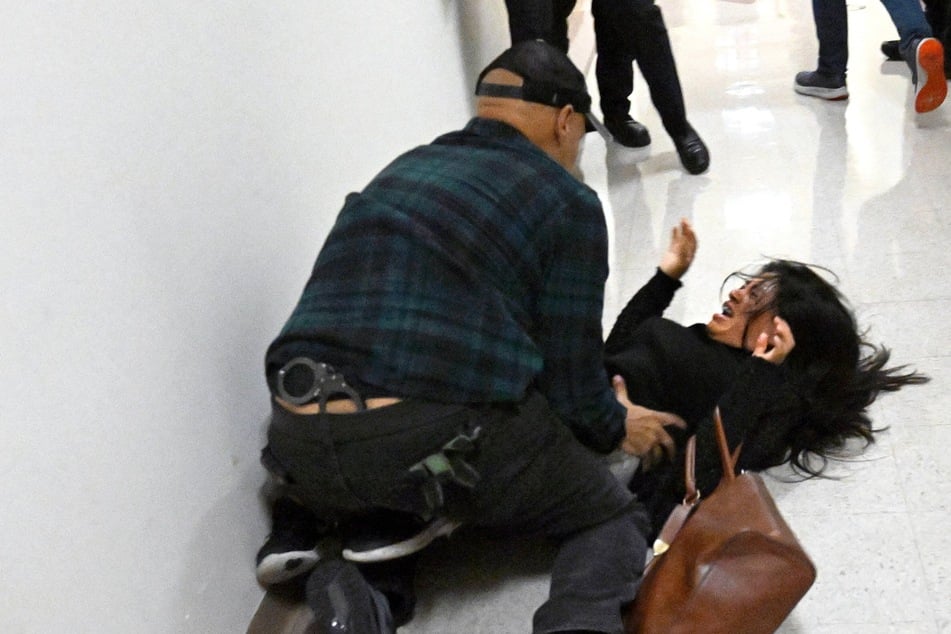 ICE agent who slammed grieving wife to the ground "relieved of current duties"