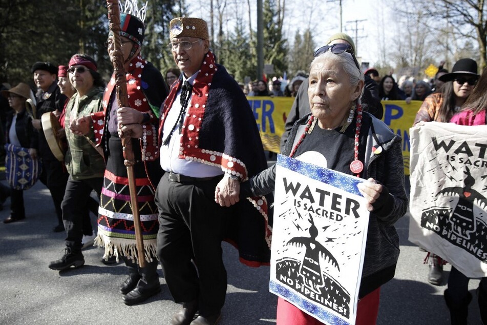 Indigenous chiefs and elders march with environmental activists against the expansion of Texas-based Kinder Morgan's Trans Mountain pipeline project in Burnaby, British Columbia.
