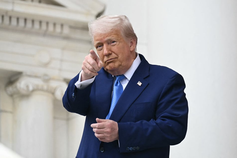 President Donald Trump arrives to deliver remarks at the National Memorial Day Observance at the Memorial Amphitheatre in Arlington National Cemetery in Arlington, Virginia, on Monday.