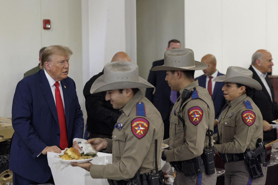 Donald Trump served meals to Texas Department of Public Safety troopers at the South Texas International airport on Sunday.