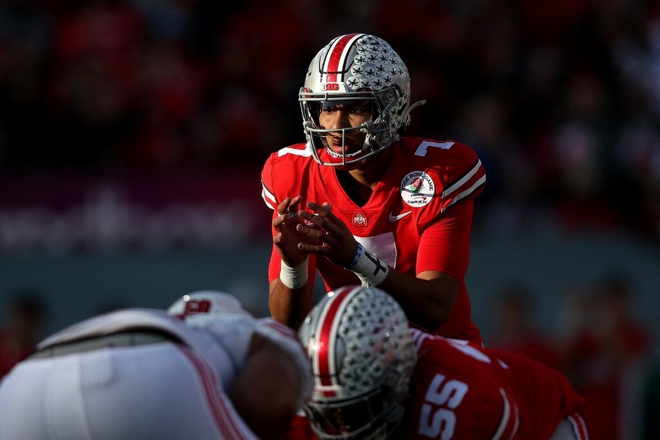 Quarterback C.J. Stroud of the Ohio State Buckeyes awaits the snap against the Utah Utes during the Rose Bowl game.