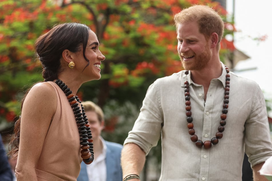 Meghan Markle (l.) and Prince Harry spoke about their children during a visit to a Nigerian elementary school.