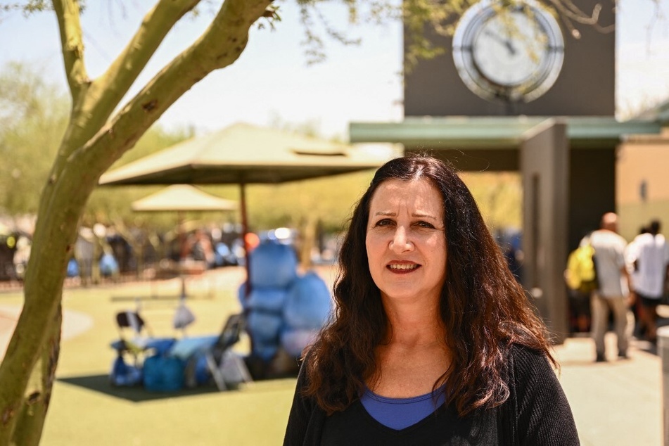 Amy Schwabenlender, chief executive officer of the Human Services Campus, stands for a portrait at the campus during a record heat wave in Phoenix, Arizona.