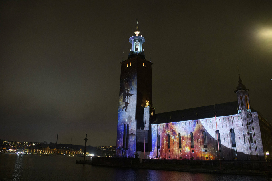 In honor of the Nobel Prize week, light tributes are displayed on some of Stockholm's famous buildings.