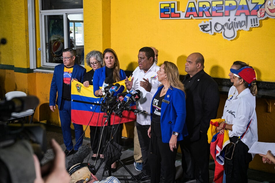 Venezuelan community leaders speak to the media as they protest against the suspension of Temporary Protected Status in Doral, Florida, on February 3, 2025.