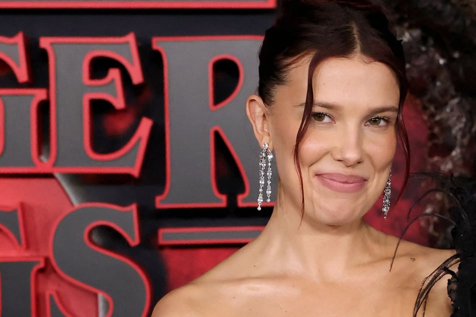 Millie Bobby Brown's baby daughter adorably crashes interview: "That's my child"