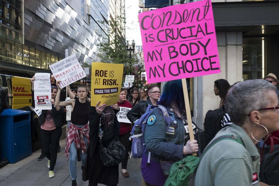 Women in Chicago rally in support of reproductive freedom after several states passed restrictive abortion bans.