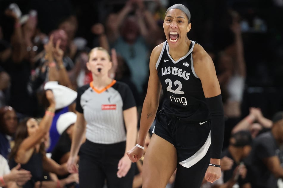 A'ja Wilson of the Las Vegas Aces celebrates after making a basket against the Phoenix Mercury in the fourth quarter of Game One of the 2025 WNBA Finals at Michelob ULTRA Arena on October 3, 2025.