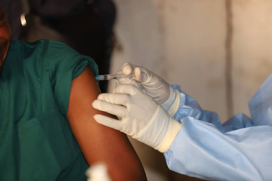 A health worker administers an Ebola vaccine shot in the Bulape health zone in the central Democratic Republic of the Congo on September 13, 2025.