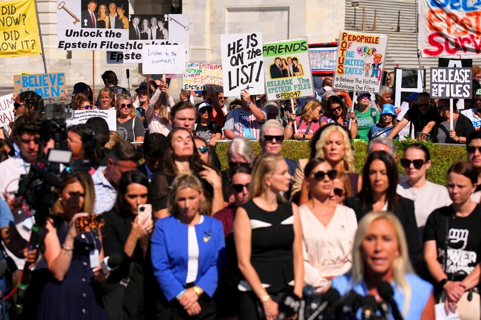 Demonstrators rally during a news conference with alleged victims of disgraced financier and sex trafficker Jeffrey Epstein in Washington DC on September 03, 2025.